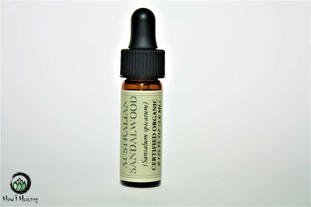 Mountain Rose Herbs® Sandalwood essential oil in an amber glass dropper bottle.