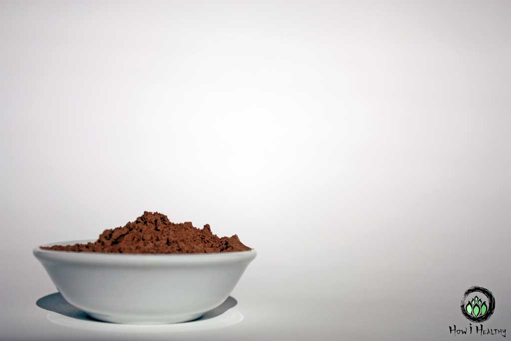 The Maca Team® maca powder in small white dish.