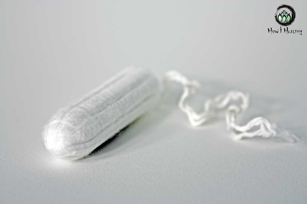 Unwrapped Natracare® organic cotton tampon.