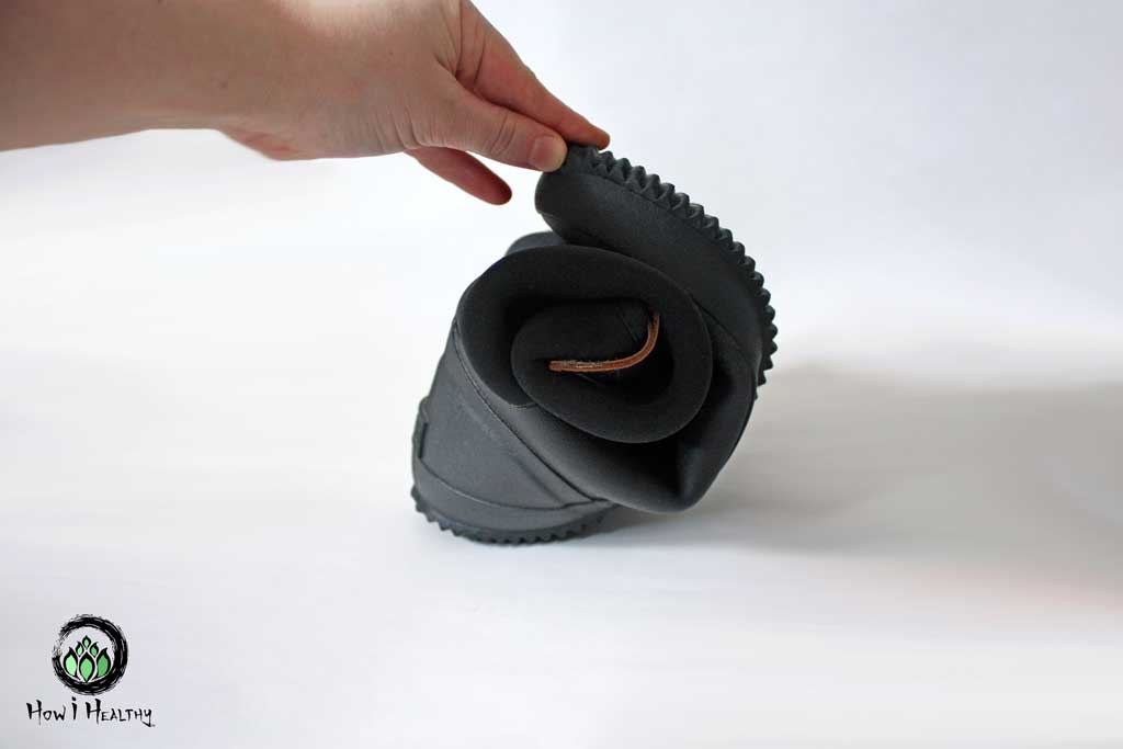 Bisgaard minimalist shoes rubber rainboot rolled up into a ball.