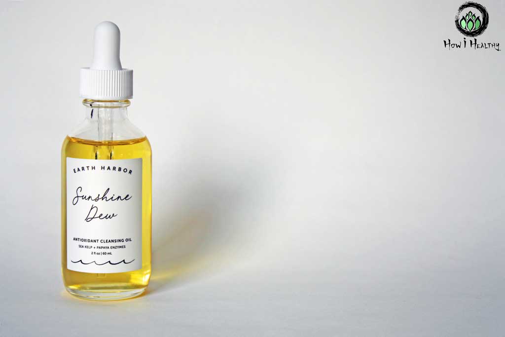 Golden cleansing oil in glass dropper bottle.