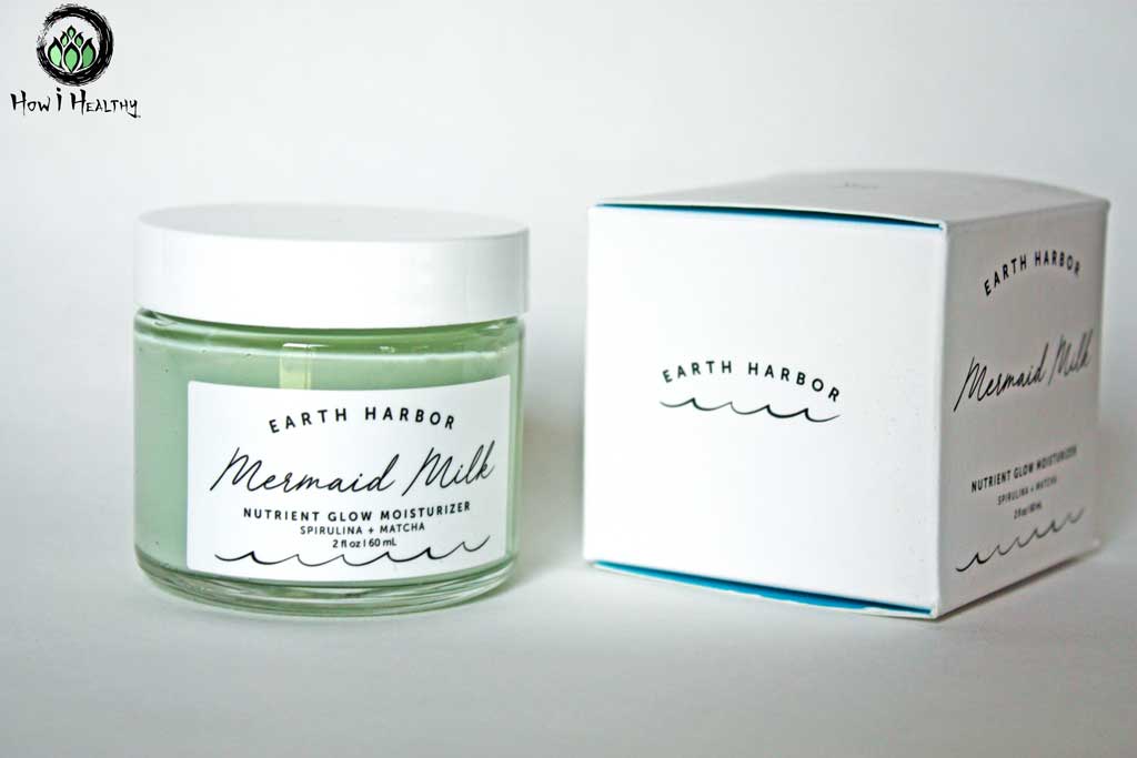 Mermaid Milk moisturizer in glass jar beside packing box.