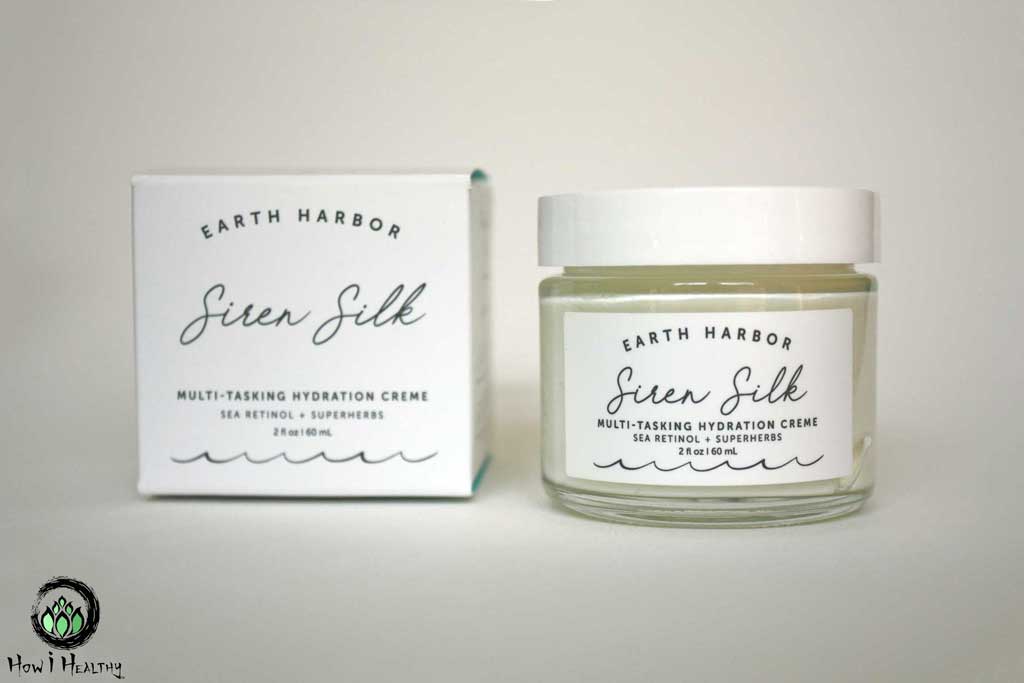 Earth Harbor Siren Silk face cream in glass jar beside paper packaging box.