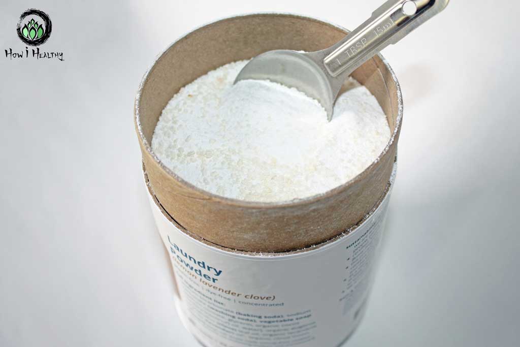 Clove scented natural laundry powder in paper canister.