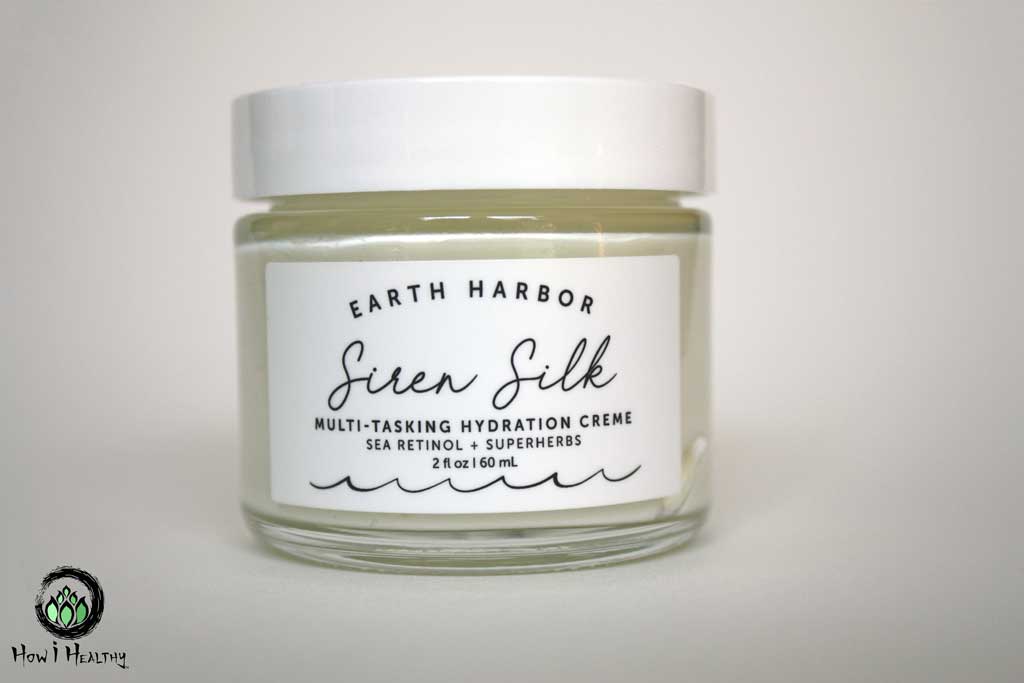 Earth Harbor face cream in glass jar.