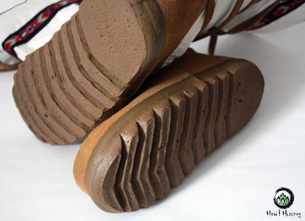 Rubber snow boot soles with deep tread.