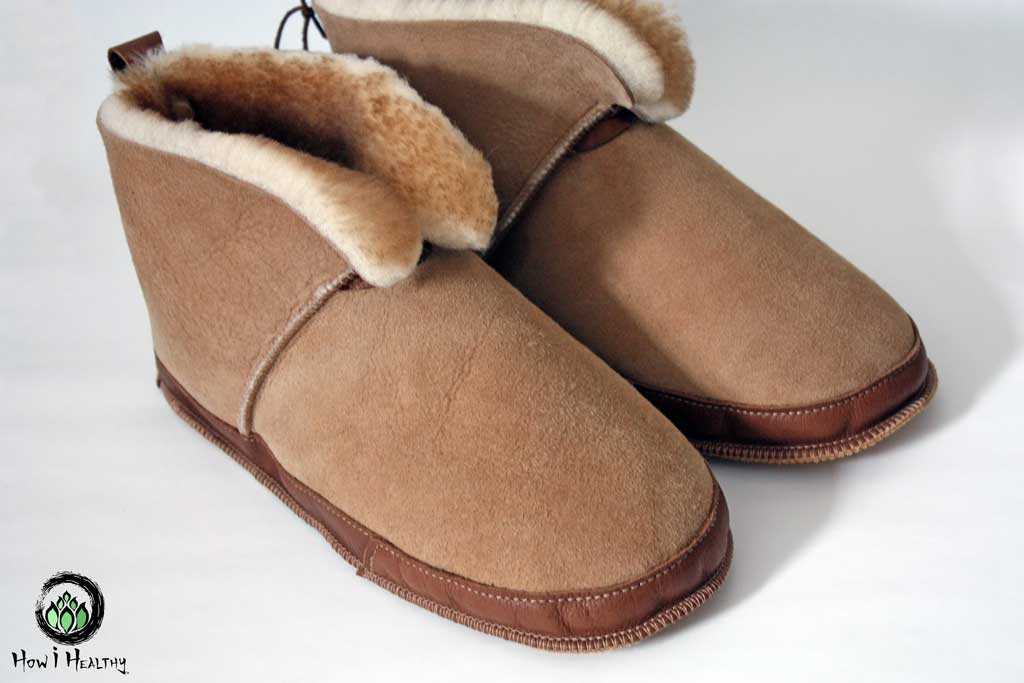 A pair of Softstar Shoes sheepskin slippers.