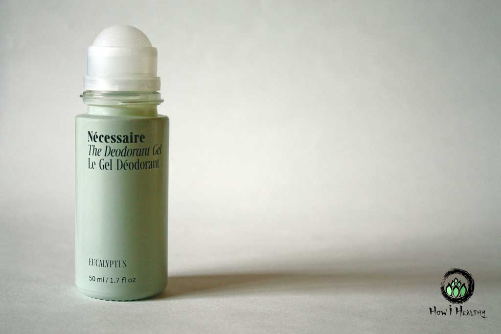 A glass deodorant bottle showing a roll on applicator.