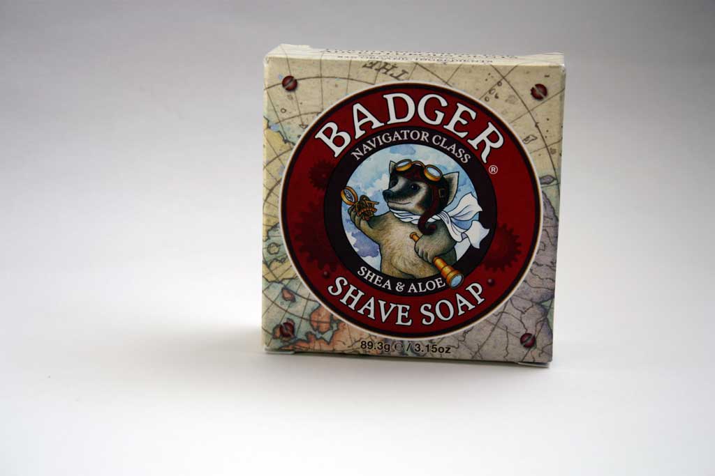 Shaving soap inside paper packaging box.