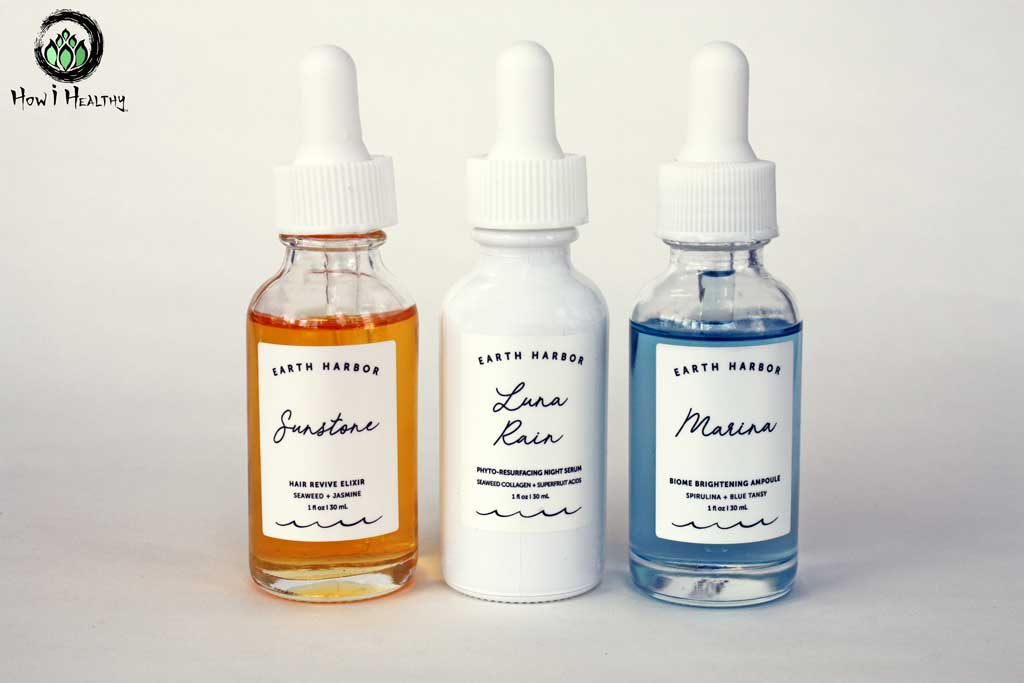 Three Earth Harbor serums in glass bottles.